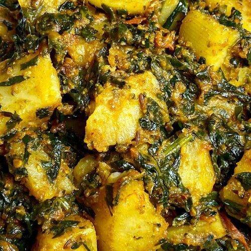 A dish of Aloo Palak, featuring potatoes and spinach cooked with spices